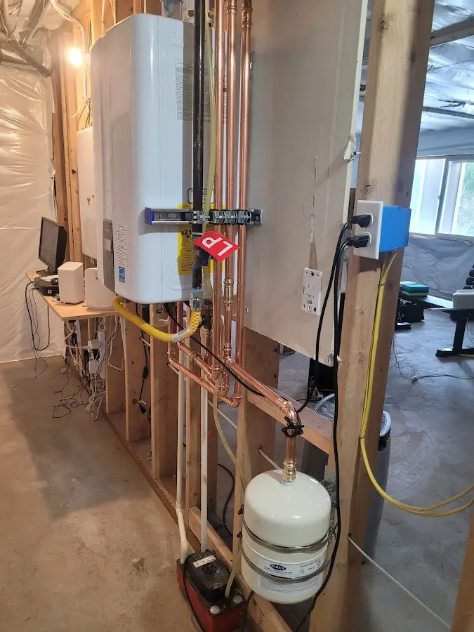 Licensed plumber repairing a kitchen sink in Colden