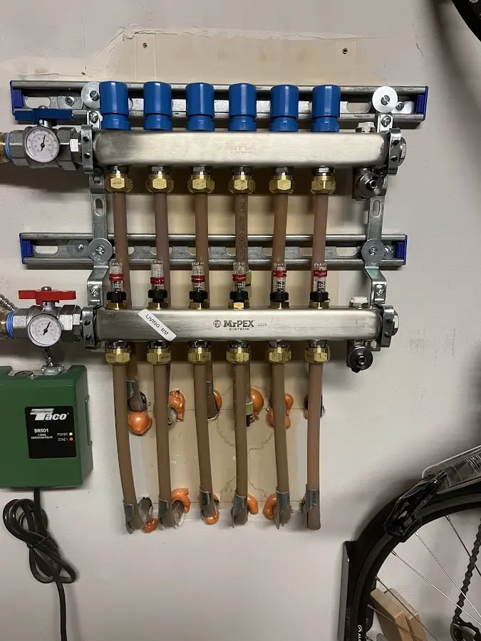 Plumber performing Water Heater Repair at a residential property in Colden